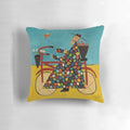 A colorful bicycle-themed pillow with a Buddhist monk design, perfect for coastal or beach-inspired decor.