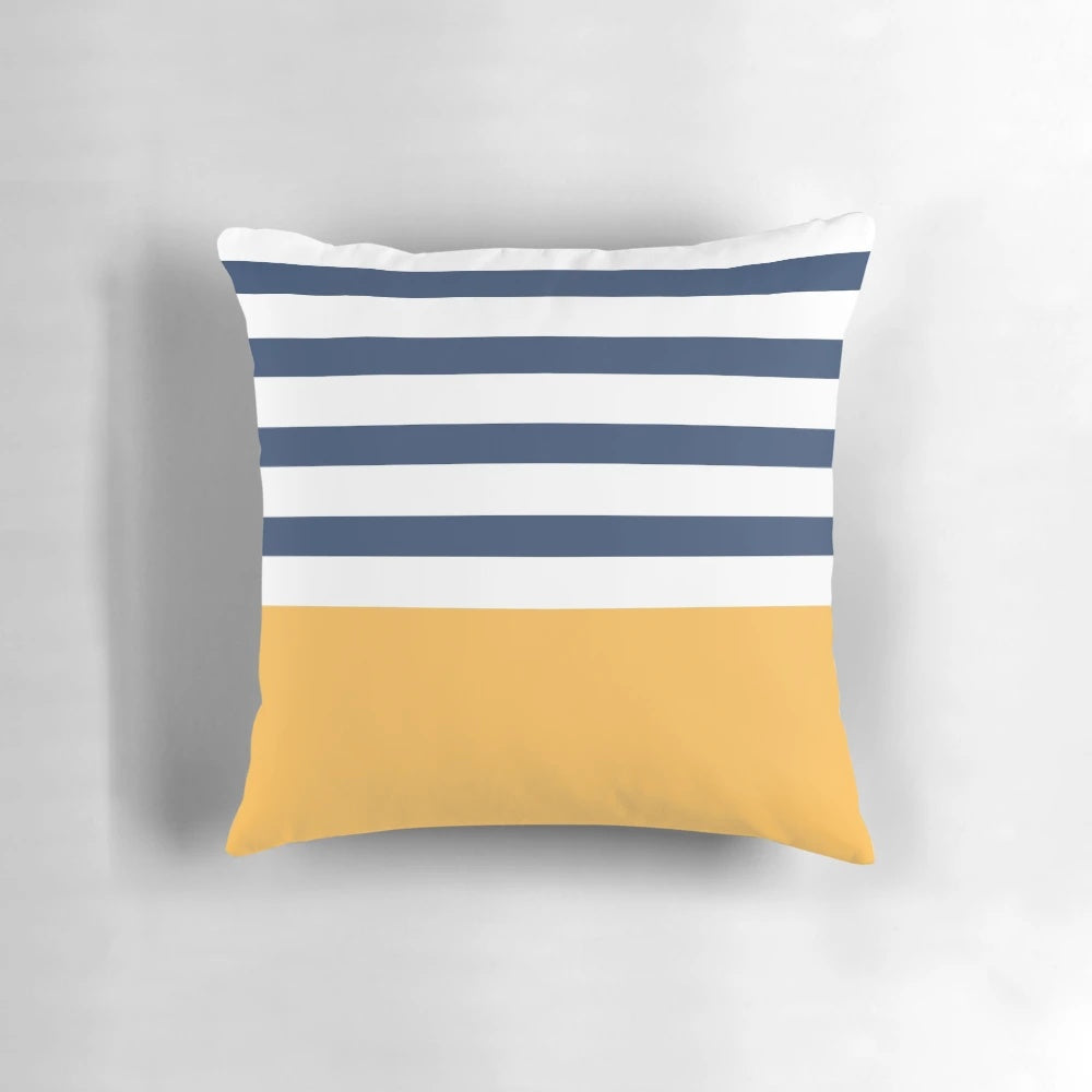Blue and white striped decorative pillow with yellow geometric pattern, perfect for nautical or coastal home decor