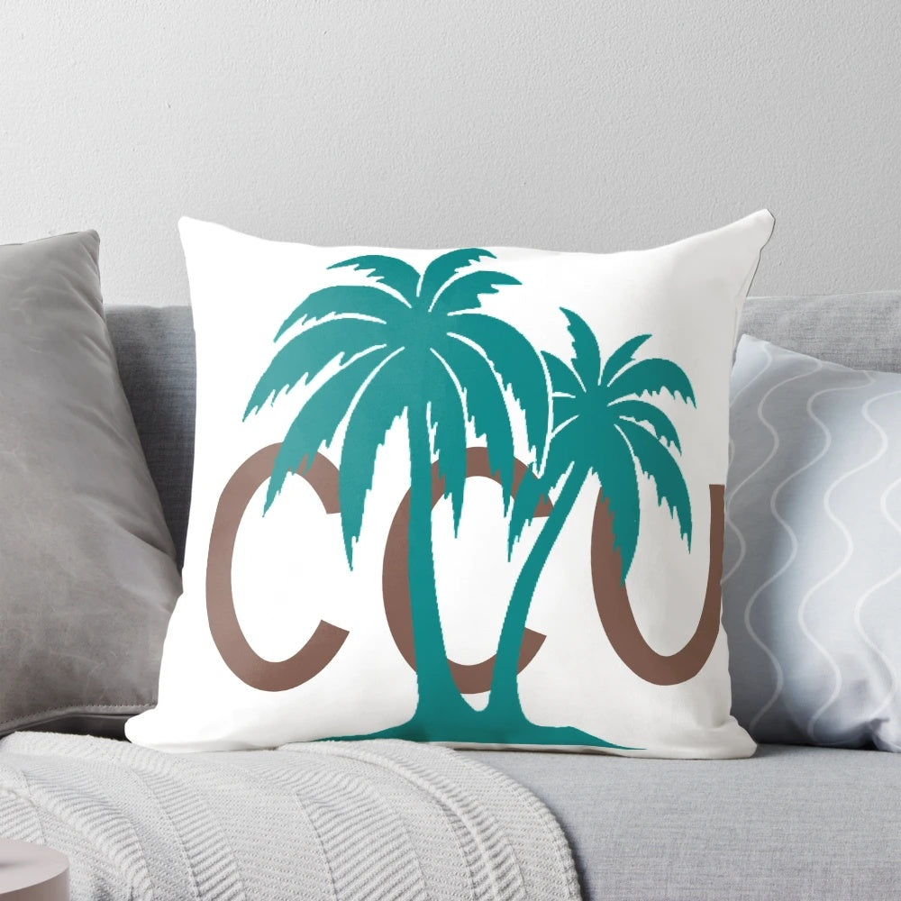 Coastal Carolina themed pillow with palm trees and Chanticleers logo