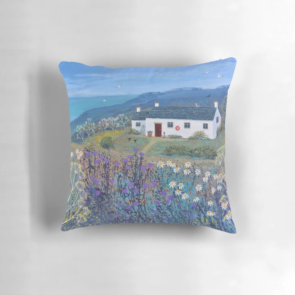 Decorative coastal-themed pillow with a serene beach scene, perfect for beach house or coastal-inspired home decor.