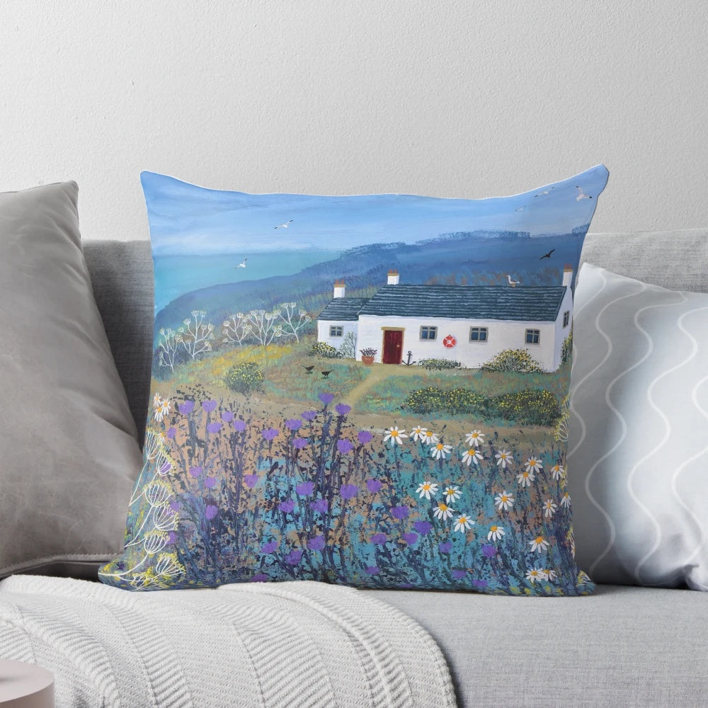Decorative coastal-themed pillow with a serene beach scene, perfect for beach house or coastal-inspired home decor.