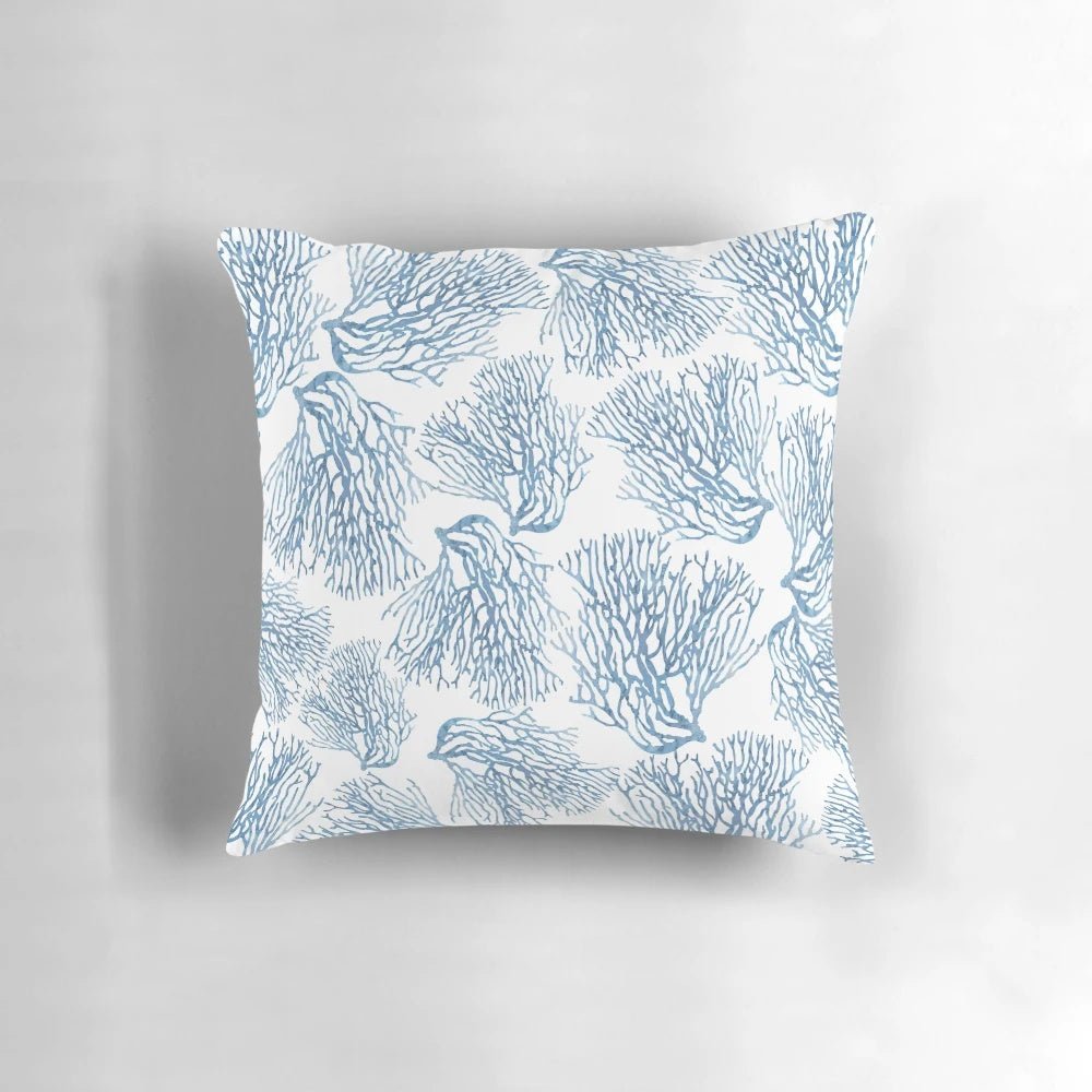 Decorative throw pillow featuring a watercolor-style blue sea fan coral pattern, perfect for coastal-inspired home decor.