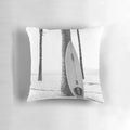 Black and white modern art pillow featuring a minimalist surfboard design, perfect for coastal and California-inspired home decor.