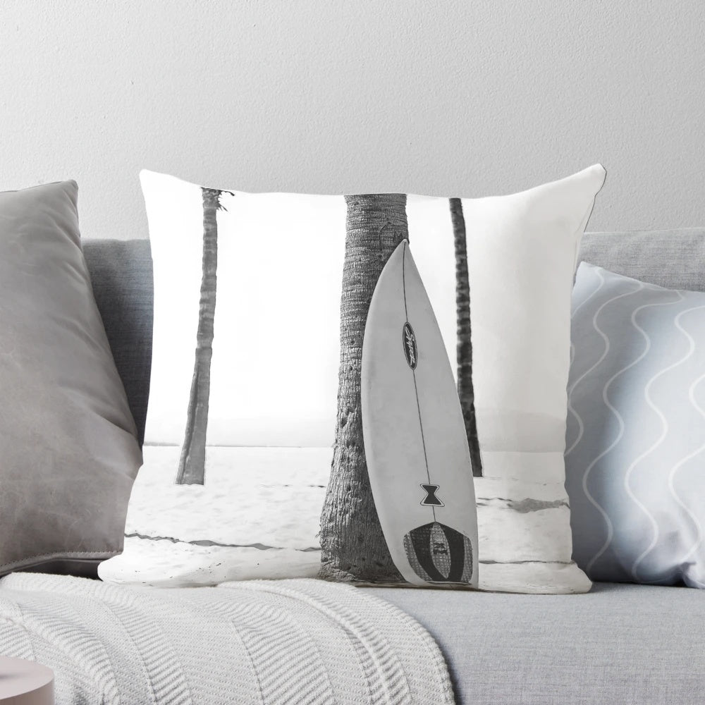 Black and white modern art pillow featuring a minimalist surfboard design, perfect for coastal and California-inspired home decor.