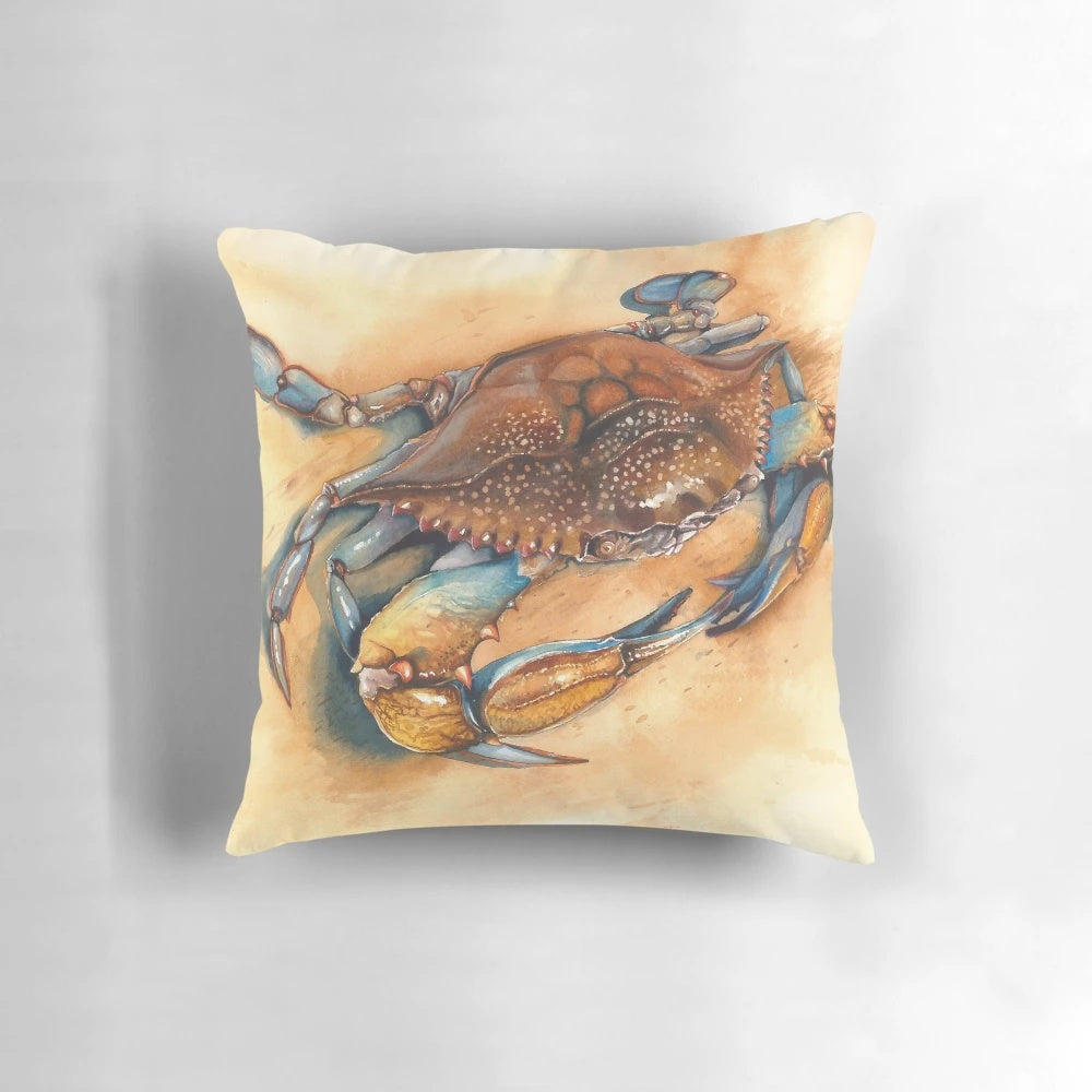 Blue crab watercolor painting on a decorative throw pillow