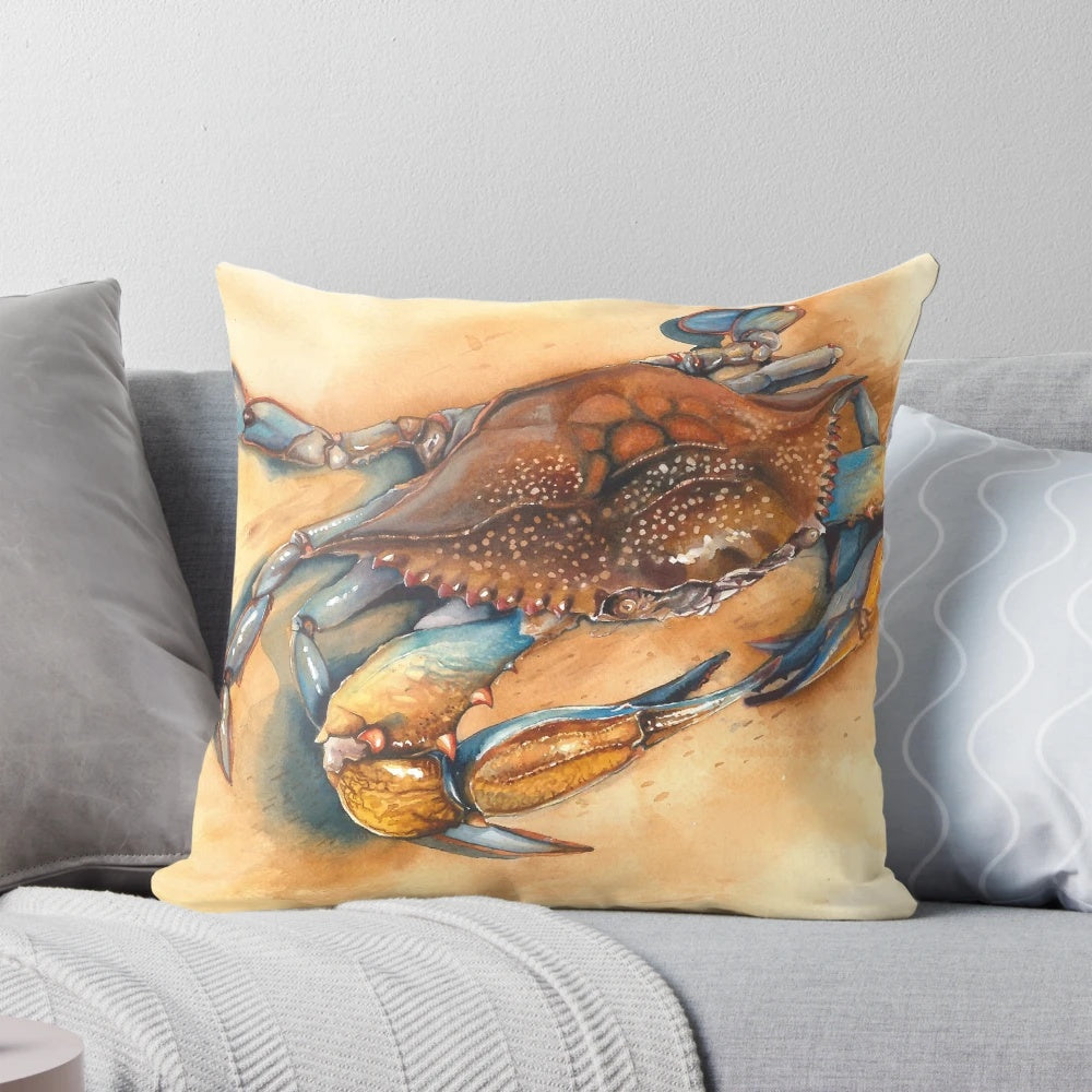 Blue crab watercolor painting on a decorative throw pillow