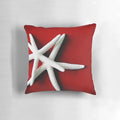 A decorative white starfish throw pillow for coastal and ocean-themed home decor.