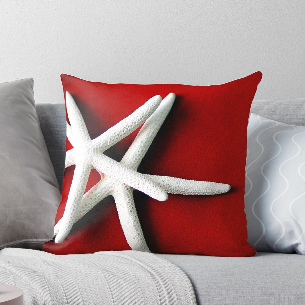 A decorative white starfish throw pillow for coastal and ocean-themed home decor.
