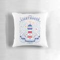 Closeup of a decorative pillow featuring a lighthouse illustration with hand-lettered coastal quote