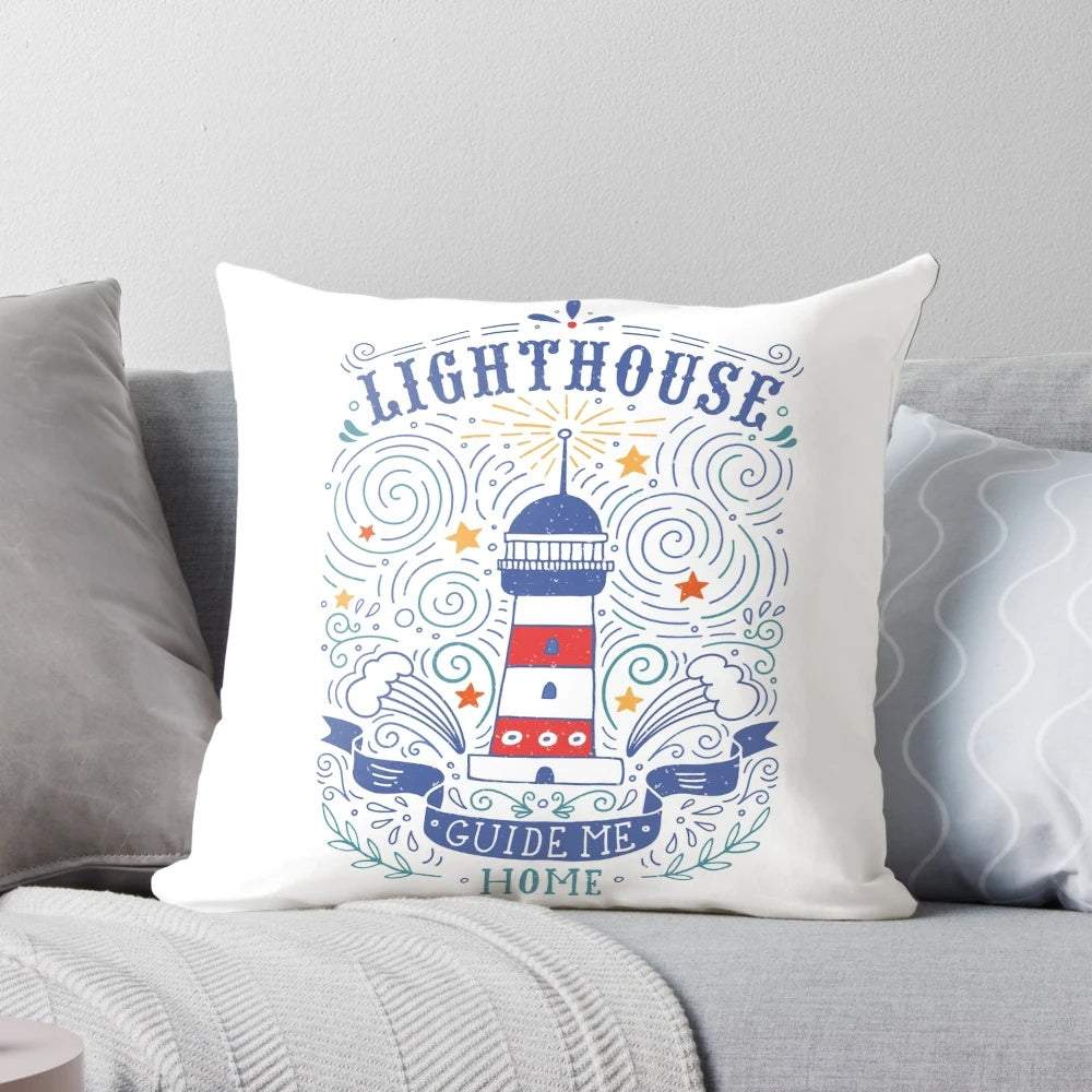 Closeup of a decorative pillow featuring a lighthouse illustration with hand-lettered coastal quote