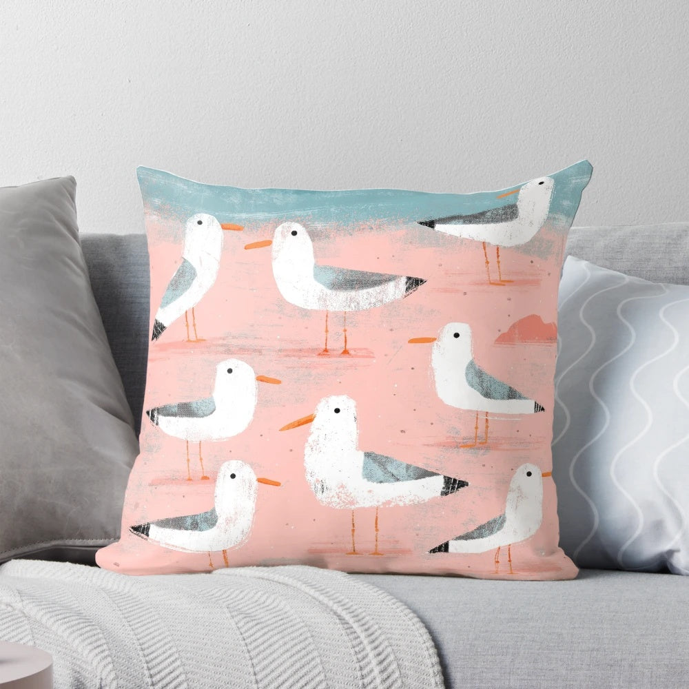 Digital illustration of seagulls flying over a coastal beach scene, used as a decorative throw pillow.