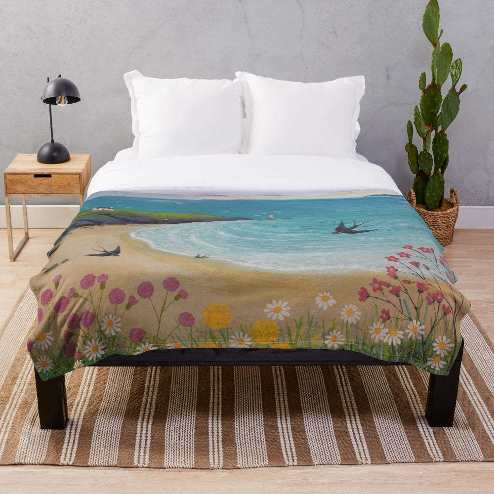 Coastal-themed plush blanket featuring swallows in a seaside landscape