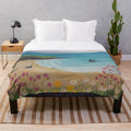 Coastal-themed plush blanket featuring swallows in a seaside landscape