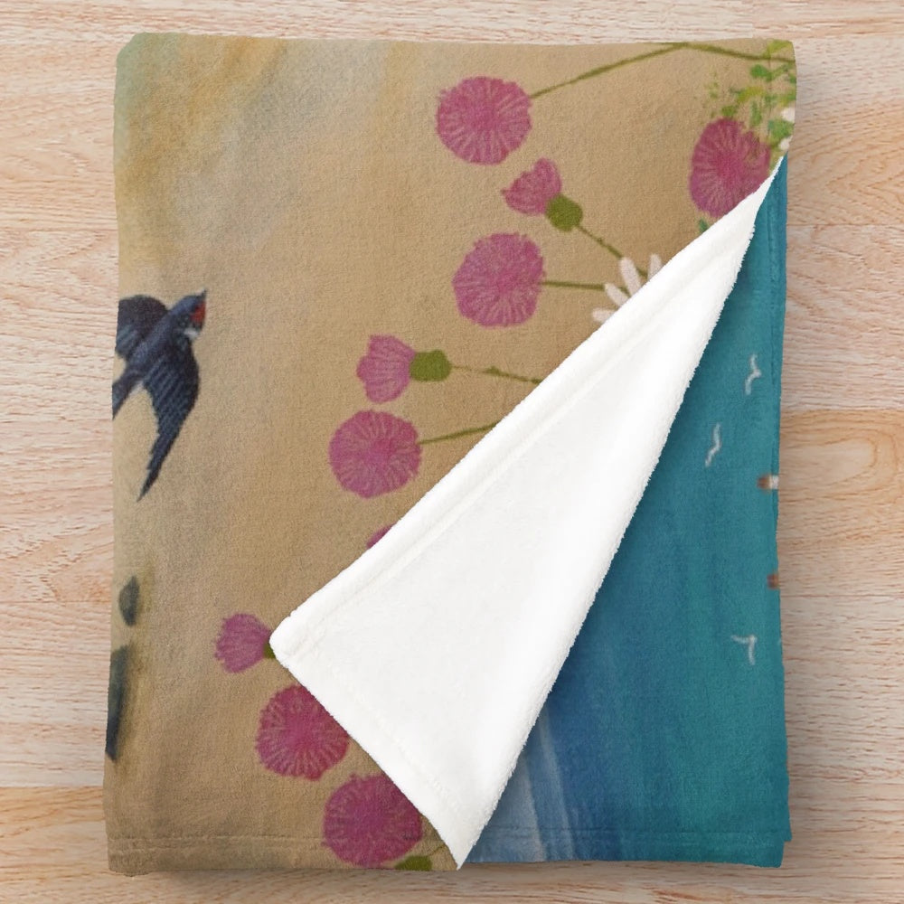 Coastal-themed plush blanket featuring swallows in a seaside landscape