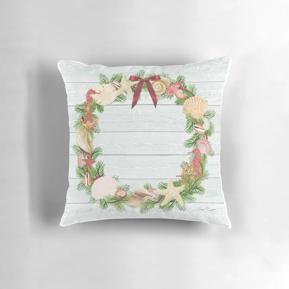 Coastal-themed Christmas decorative pillow with various nautical and holiday elements