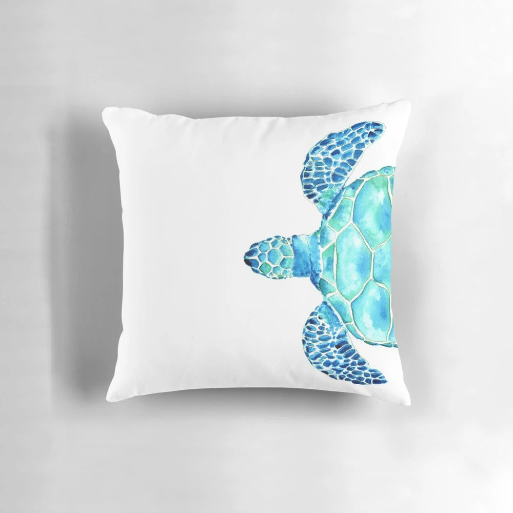 Coastal-themed watercolor painting of a sea turtle on a decorative pillow