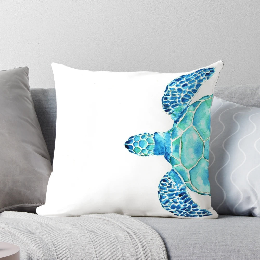 Coastal-themed watercolor painting of a sea turtle on a decorative pillow