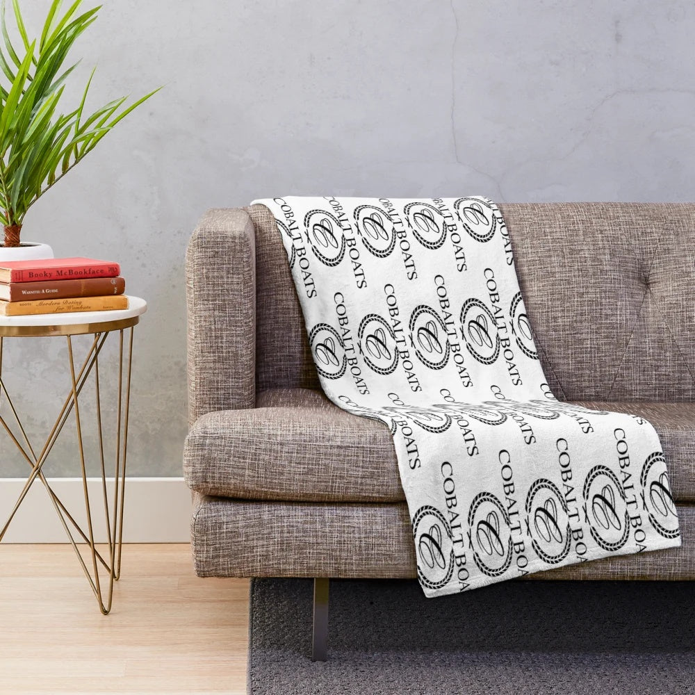 Cobalt blue plush blanket featuring a classic boat cruiser design