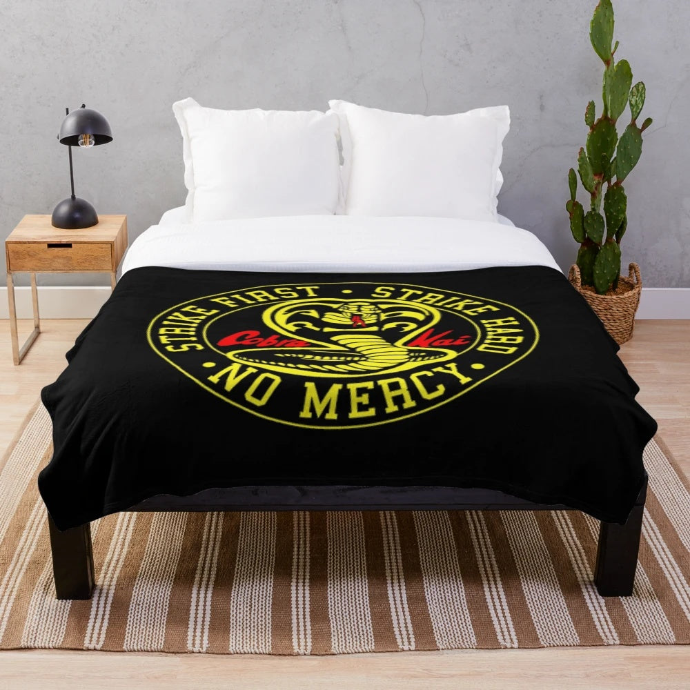 Cobra Kai inspired plush blanket featuring retro karate kid design