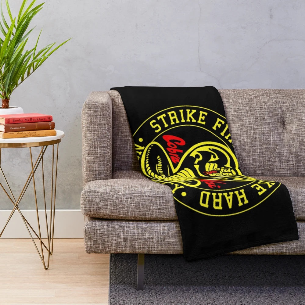 Cobra Kai inspired plush blanket featuring retro karate kid design