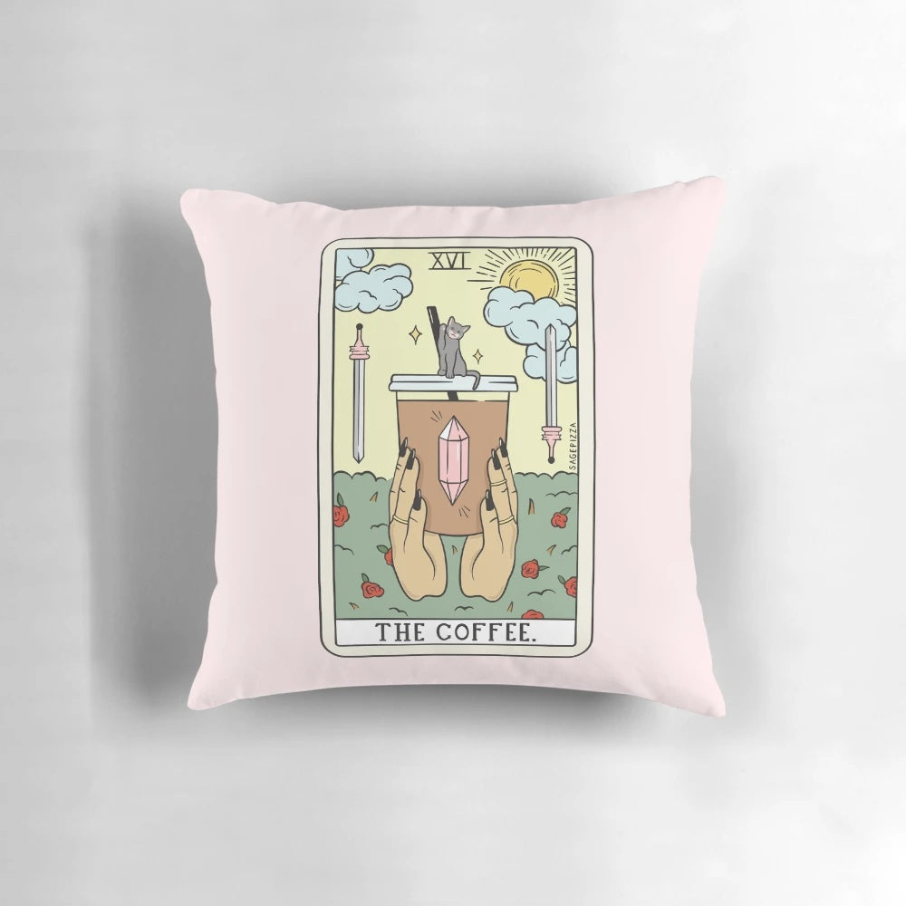 A cozy and mystical coffee reading tarot pillow with a cat and hands design