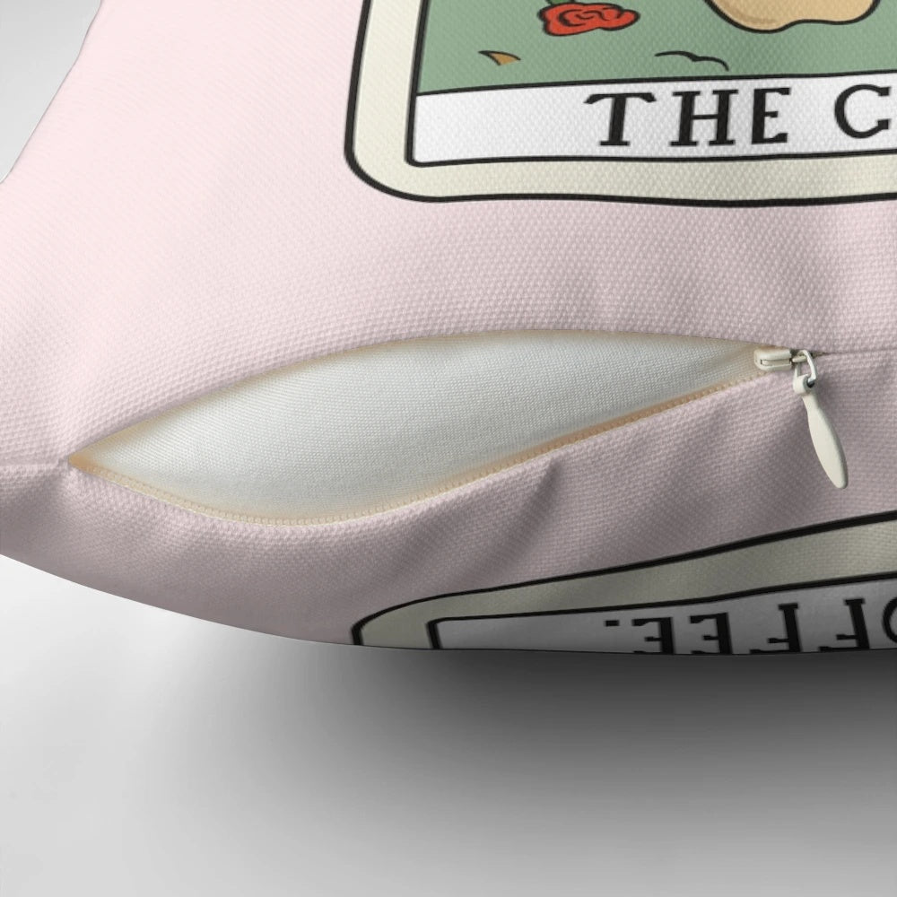 A cozy and mystical coffee reading tarot pillow with a cat and hands design