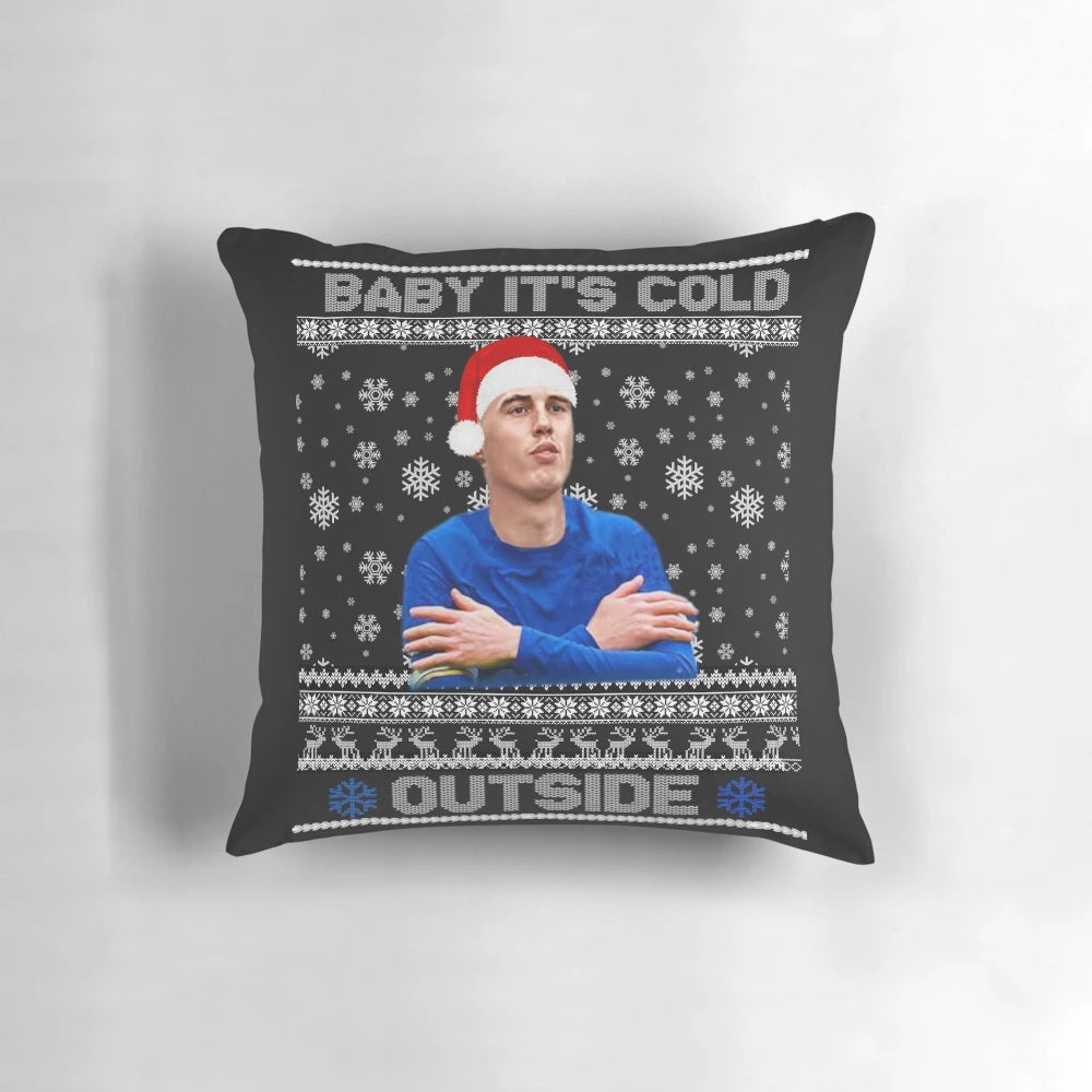 A cozy and festive pillow featuring the phrase "It's Cold Outside" with Cole Palmer's name and holiday designs.