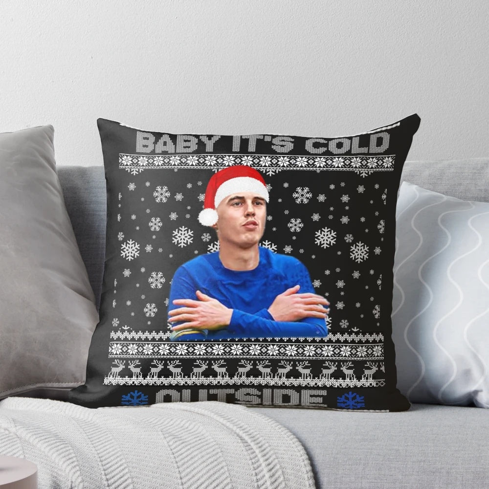 A cozy and festive pillow featuring the phrase "It's Cold Outside" with Cole Palmer's name and holiday designs.