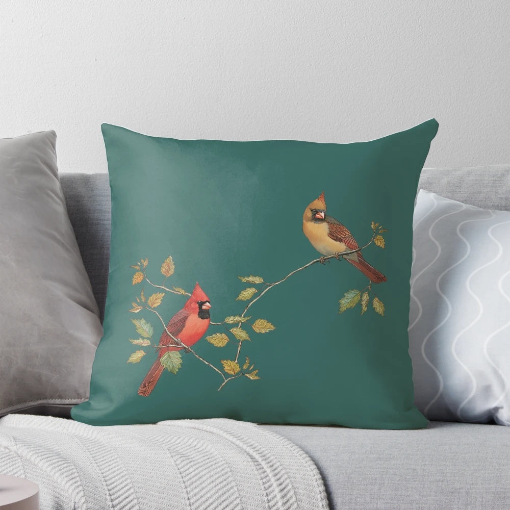 A beautifully crafted cardinal couple pillow featuring a male and female cardinal perched on autumn leaves.
