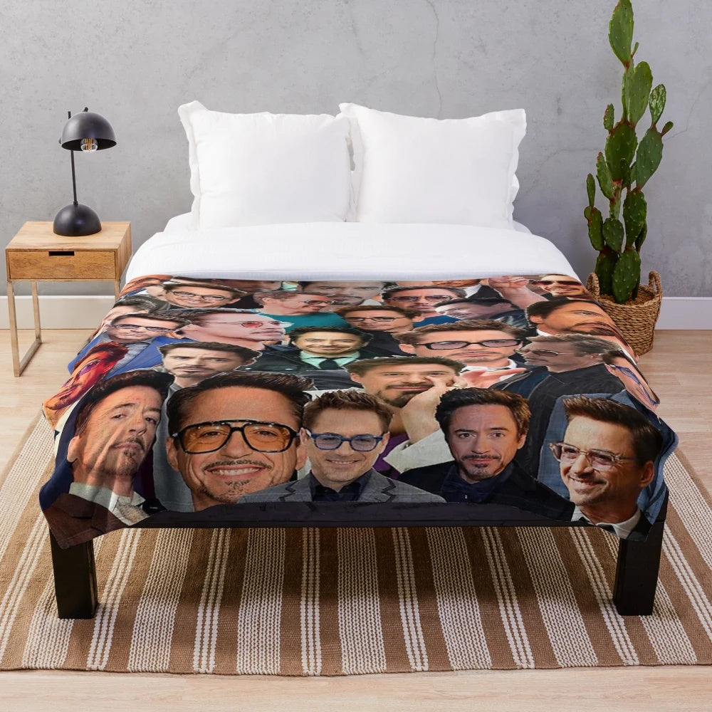 Plush blanket featuring a collage of photos of actor Robert Downey Jr. in his iconic Marvel roles