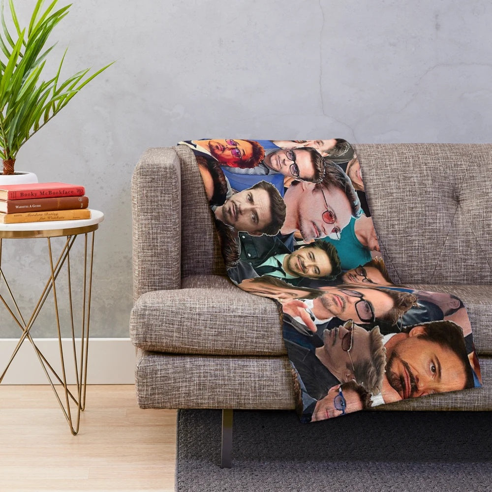 Plush blanket featuring a collage of photos of actor Robert Downey Jr. in his iconic Marvel roles
