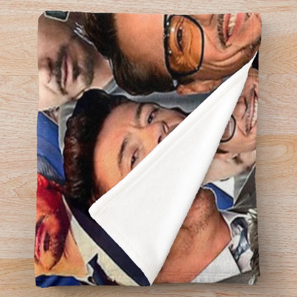 Plush blanket featuring a collage of photos of actor Robert Downey Jr. in his iconic Marvel roles