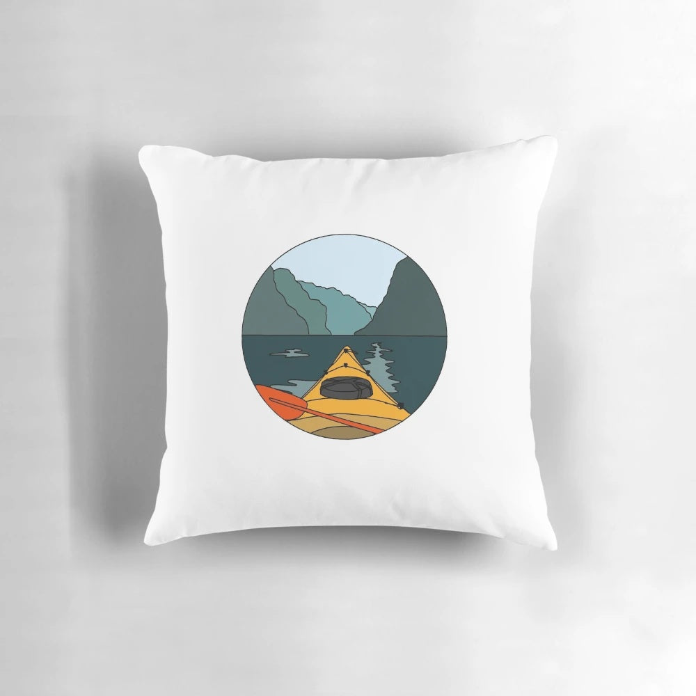 Vibrant colorblock pillow design featuring a serene kayak scene on a lake
