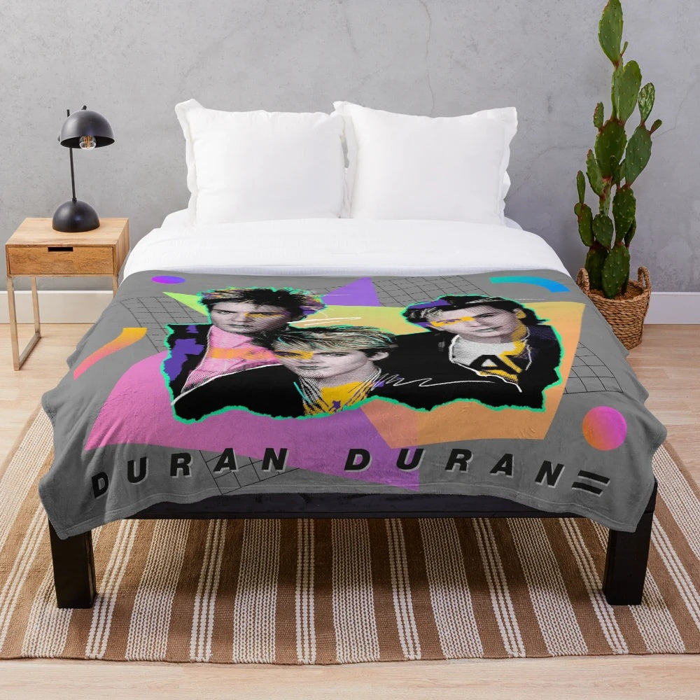 Vibrant 80s-style plush blanket with bold colors and retro music-inspired patterns