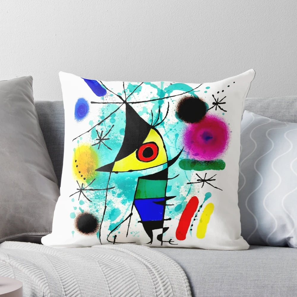 Vibrant abstract surrealist throw pillow featuring whimsical fish motif, inspired by the artwork of Joan Miró.