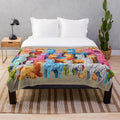 Colorful alpaca plush blanket with cute art design featuring Peruvian alpacas and mountains