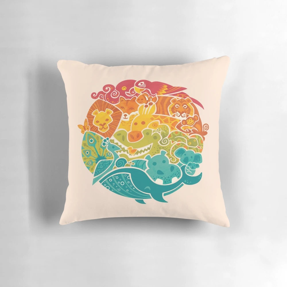 Cream-colored pillow featuring a vibrant collage of various animals including an octopus, parrot, tiger, and more.