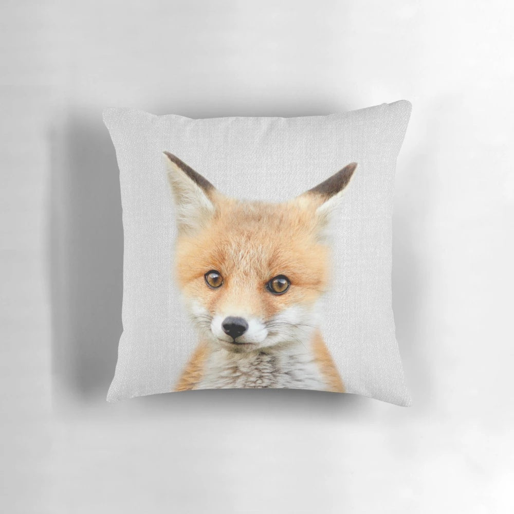 Soft, colorful pillow featuring a cute baby fox design, perfect for a modern nursery or child's room.