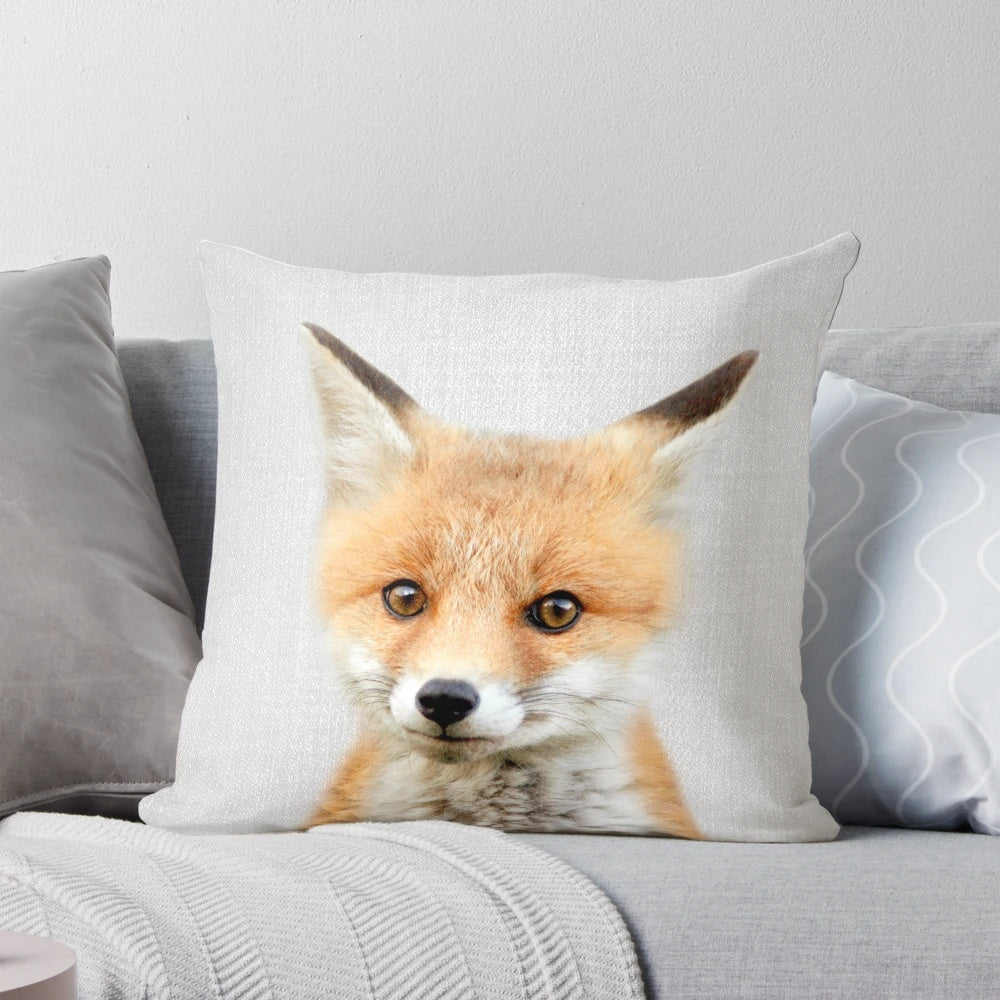 Soft, colorful pillow featuring a cute baby fox design, perfect for a modern nursery or child's room.