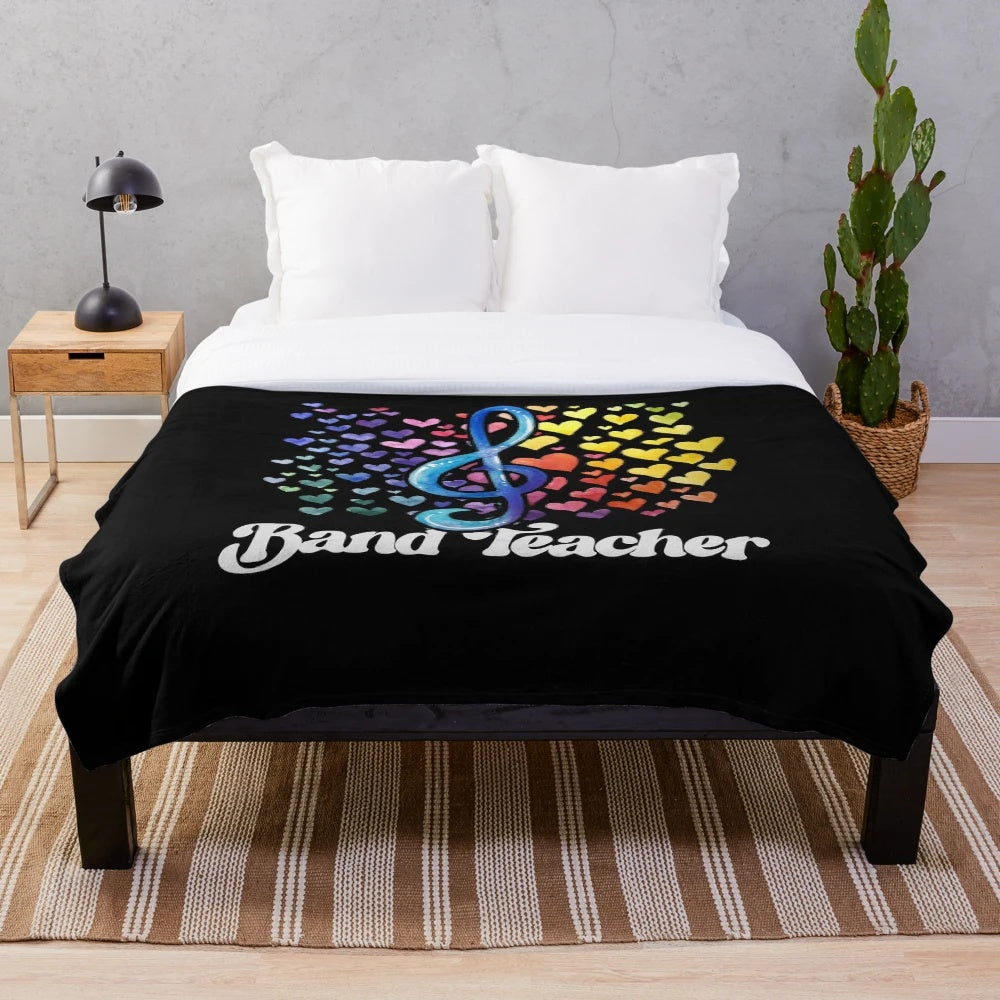Colorful plush blanket featuring a band teacher design with rainbows, hearts, and a retro style
