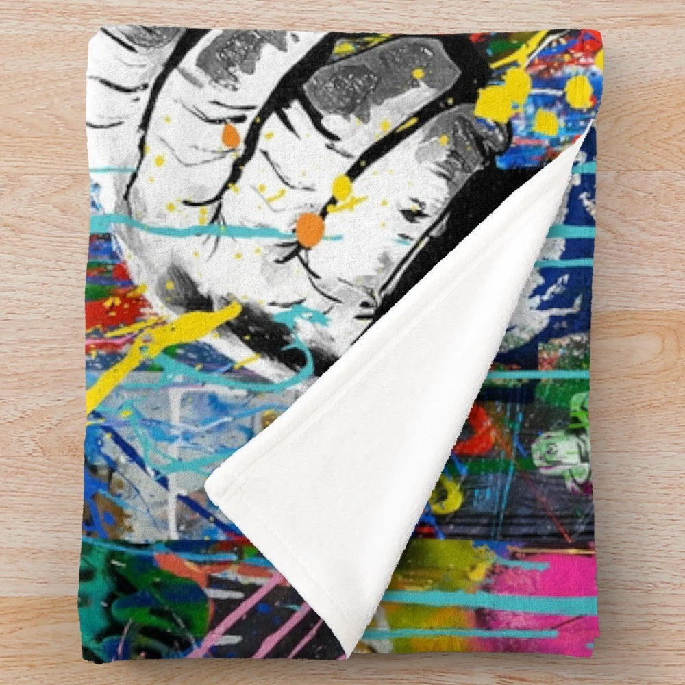 Colorful Banksy-inspired plush blanket featuring a monkey thinker urban art design