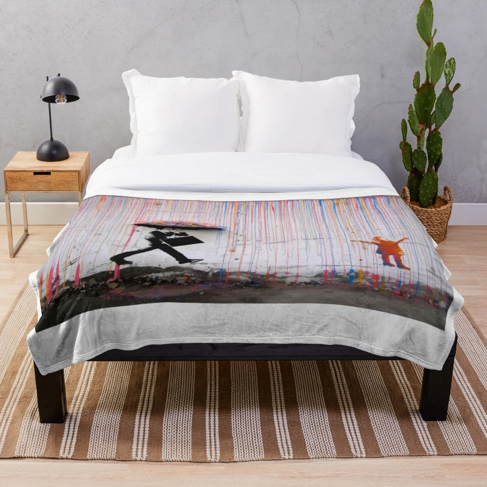 Cozy plush blanket featuring a vibrant, street art-inspired design of a girl with a rainbow umbrella