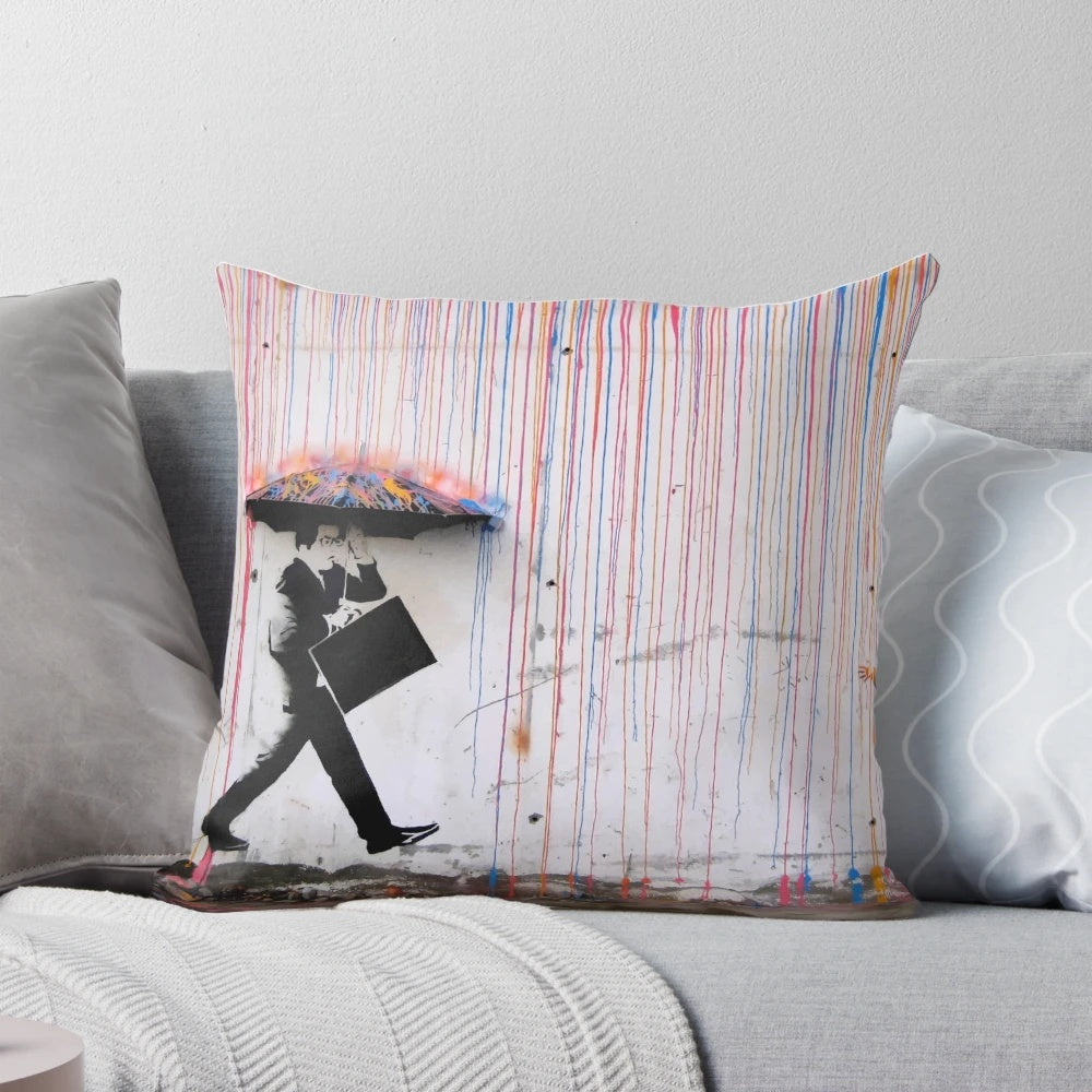 Colorful pillow design featuring a Banksy-inspired image of a girl holding a rainbow umbrella