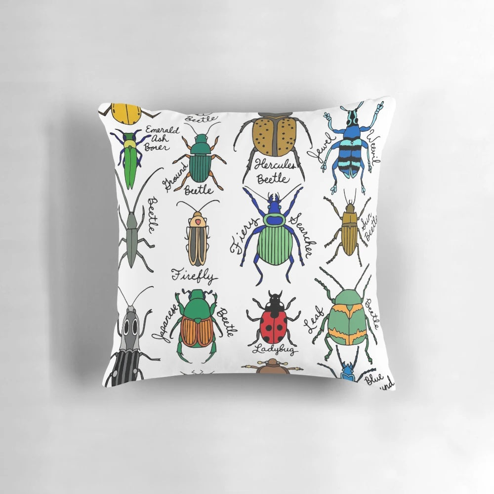 Detailed illustration of colorful beetles, bugs, and insects on a decorative throw pillow.