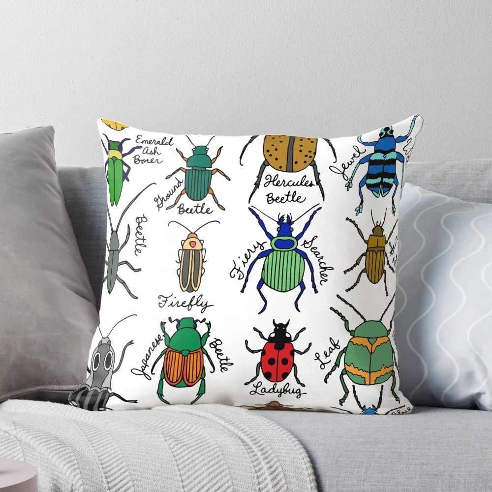 Detailed illustration of colorful beetles, bugs, and insects on a decorative throw pillow.
