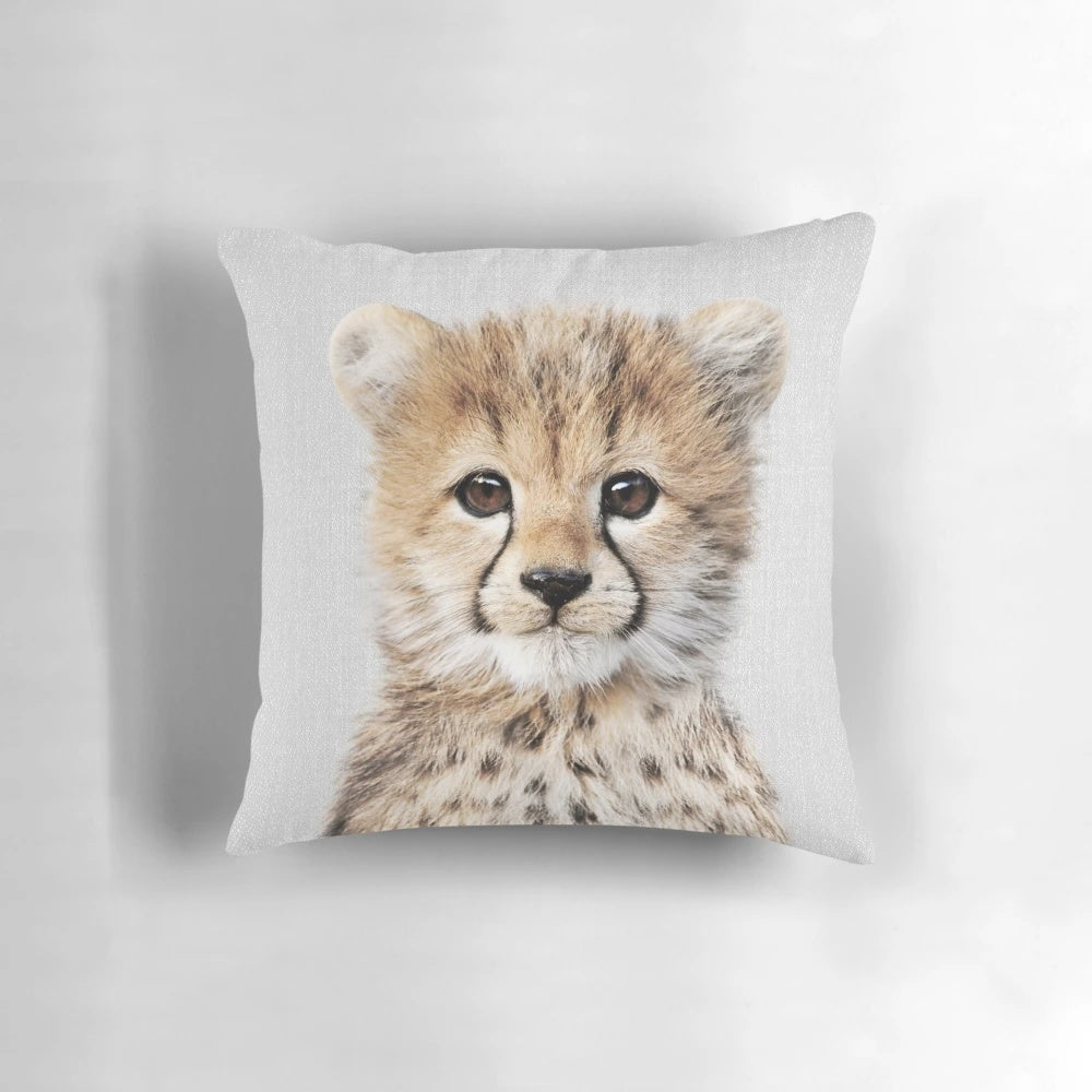 A colorful and modern throw pillow featuring a stylized cheetah cub design, perfect for nursery and home decor.