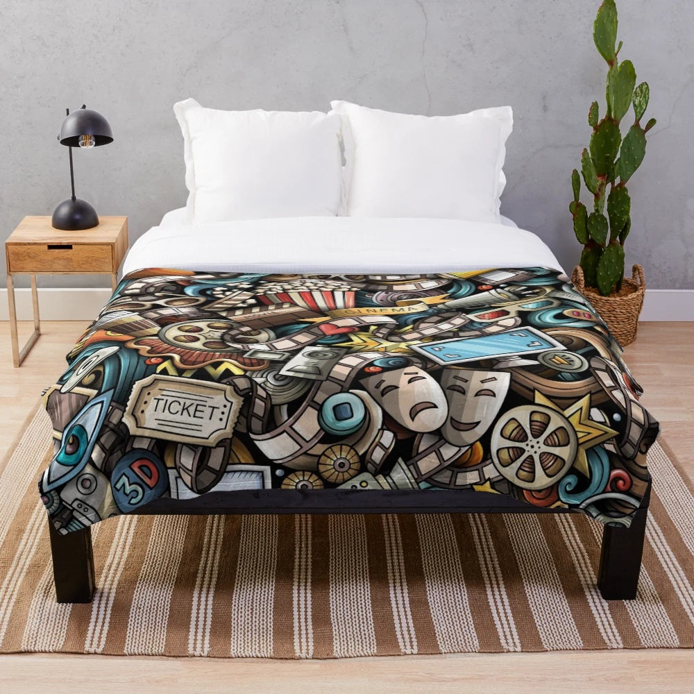 Colorful cinema-themed plush blanket with fun doodle design