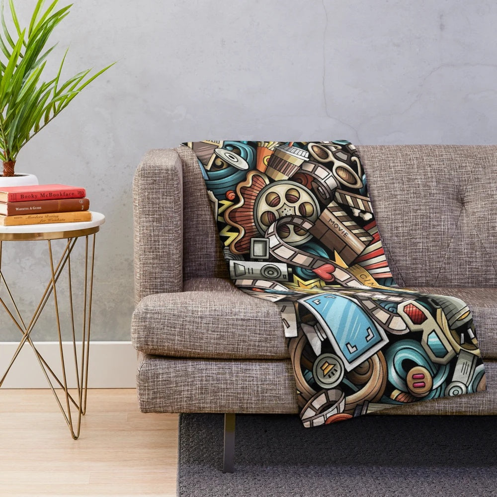 Colorful cinema-themed plush blanket with fun doodle design