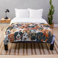 Colorful collage of painted dog faces on a plush blanket