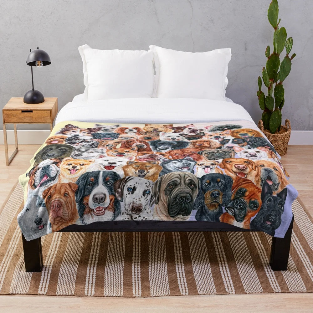 Colorful collage of painted dog faces on a plush blanket